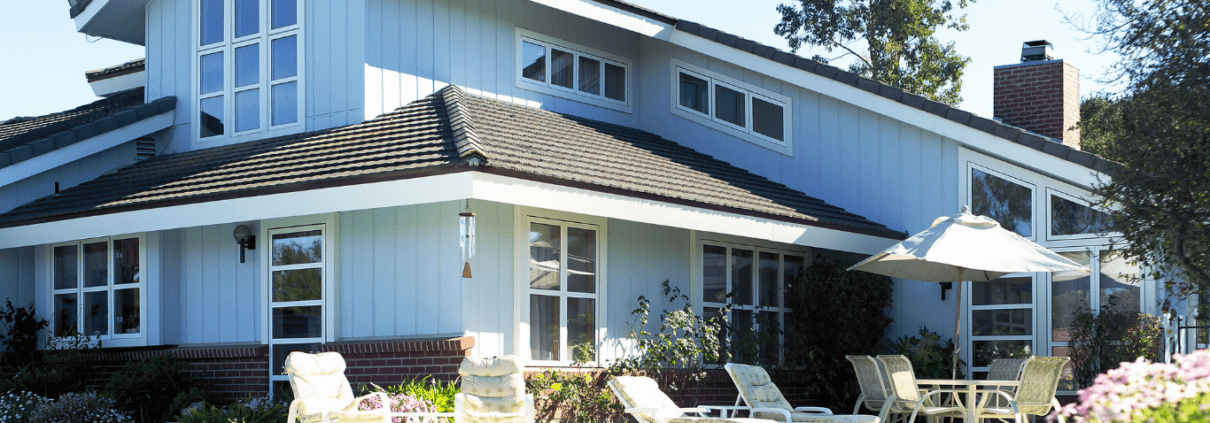 House displaying areas to be inspected during the home inspection, such as roof, windows, siding, and swimming pool.